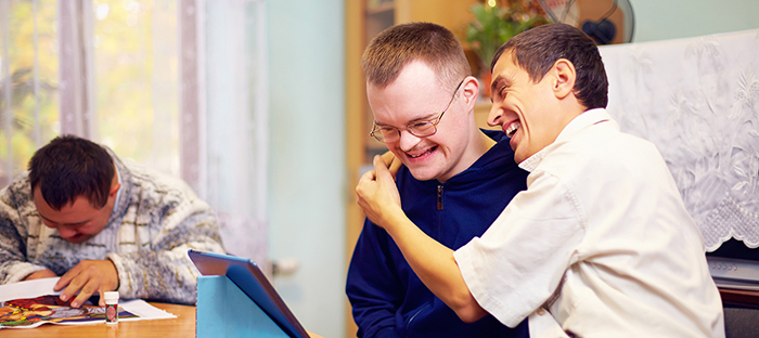 Two male friends laughing