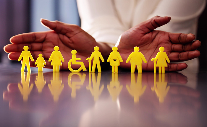 Yellow human-shaped figures, including people with visible disabilities such as a wheelchair user and a person using a cane