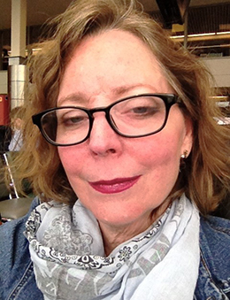 Christy - smiling woman in glasses