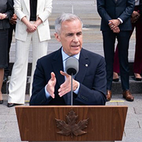 Prime Minister Mark Carney at the podium outside Rideau Hall announcing his Federal Cabinet