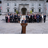Prime Minister Mark Carney at the podium outside Rideau Hall announcing his Federal Cabinet