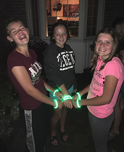 Kids wearing light up wristbands
