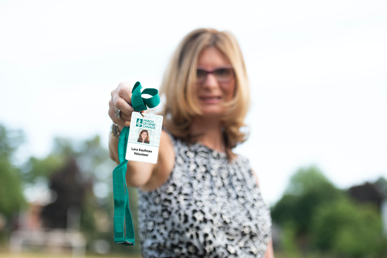 Lara with MODC volunteer badge