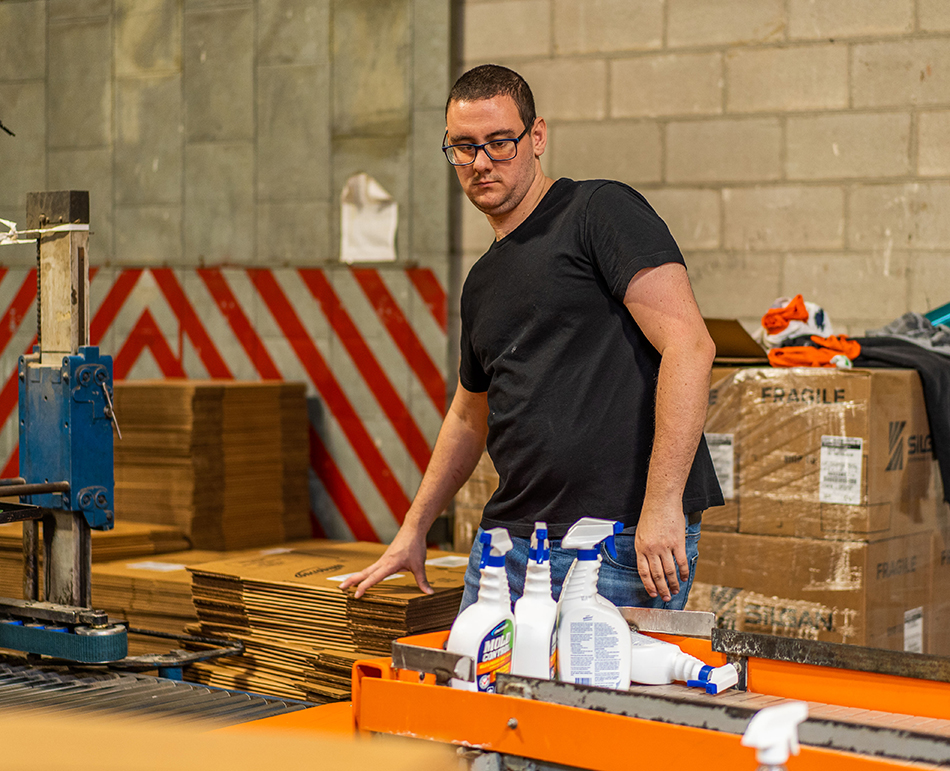 Employment Services client working in warehouse