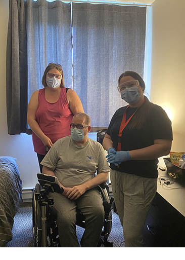 Two Community Support Services staff and client