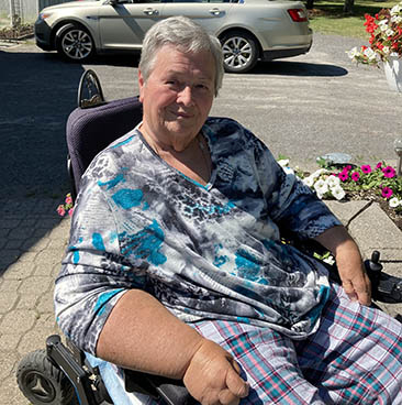 smiling woman in wheelchair