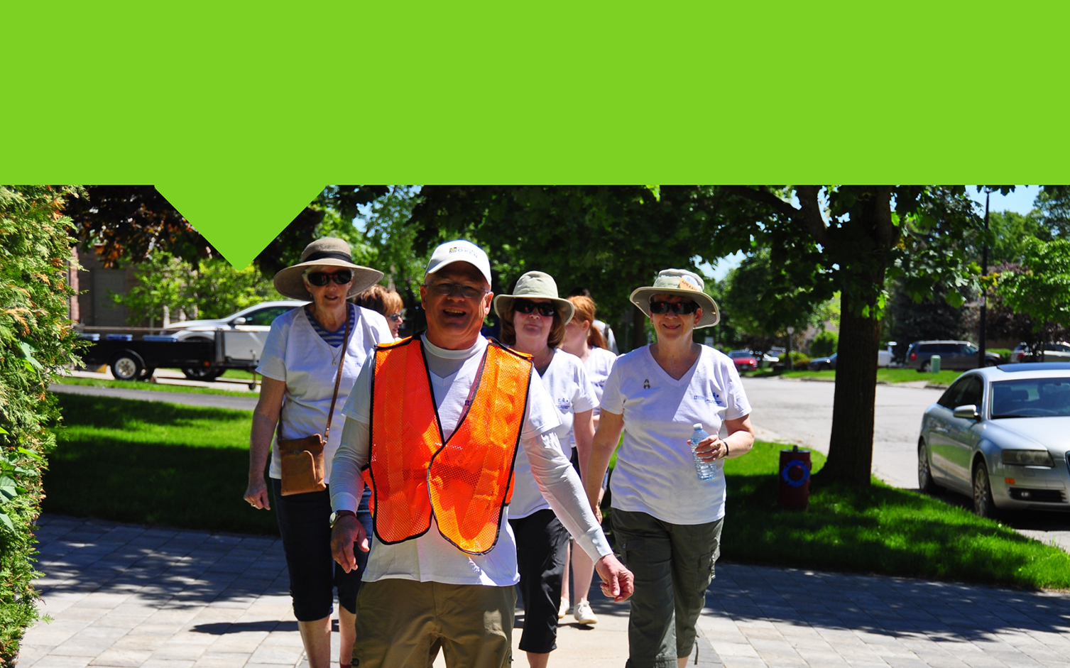 Smiling group of adults walking in the neighbourhood