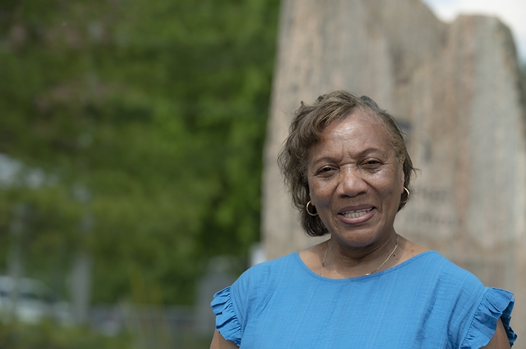 Faye Sandy - a smiling older woman standing outside in a park