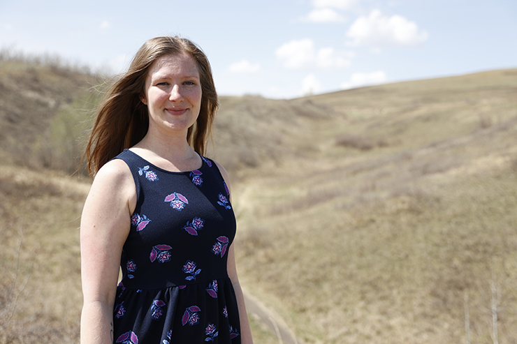 Jamie Suderman - a smiling woman standing in a field