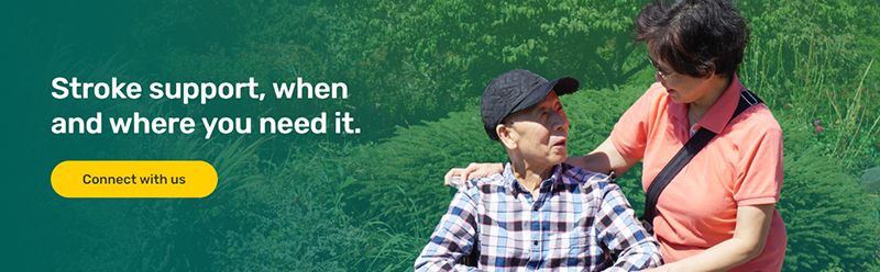 Woman smiling down at man in wheelchair - Stroke support, when and where you need it