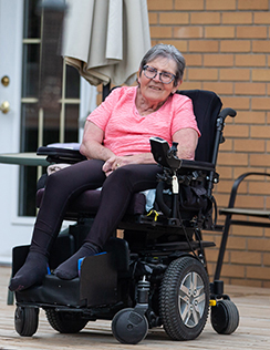 Senior woman Rose sitting on her back porch