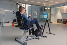 Child on exercise bike machine.