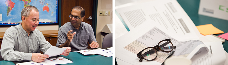 People reviewing documents and paperwork displayed